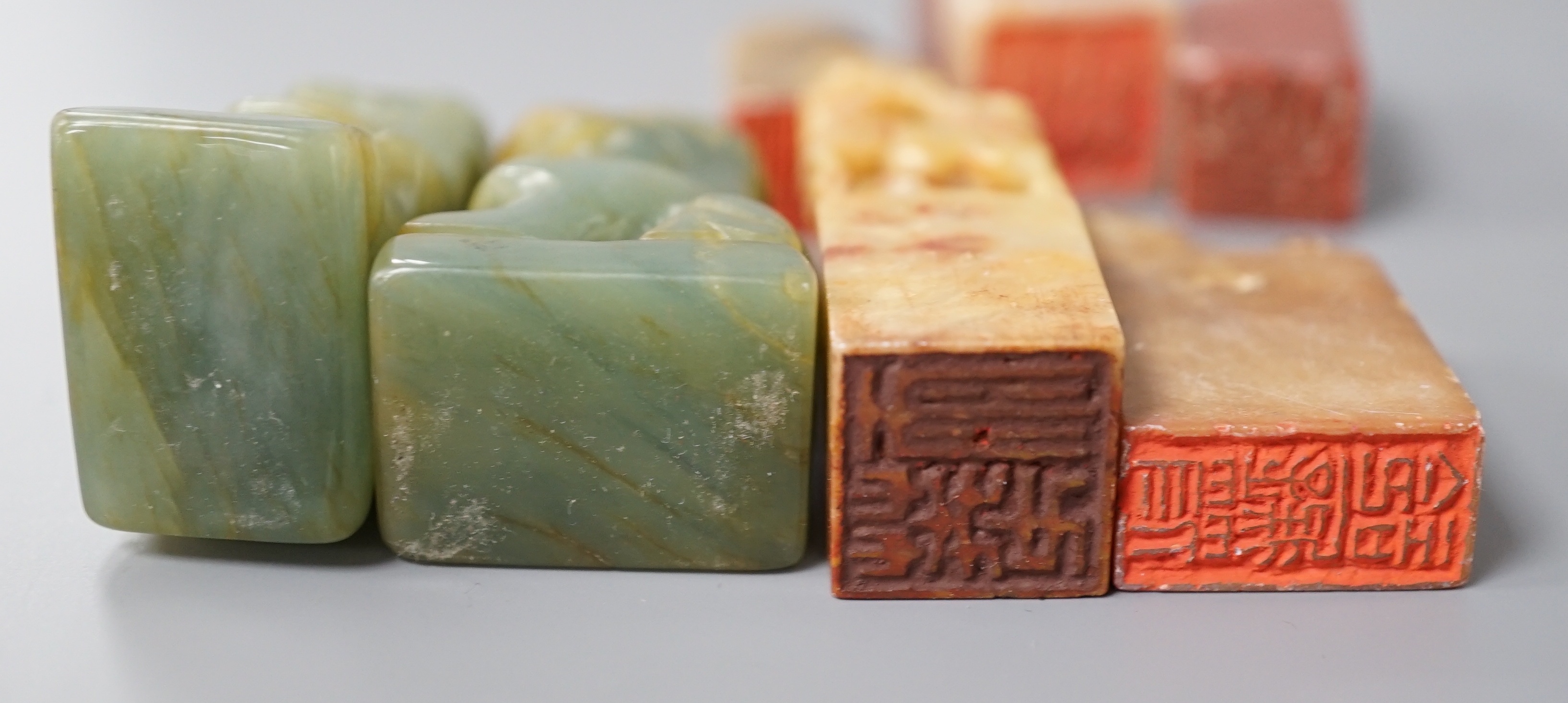A selection of five Chinese mixed stone seals together with a pair of small jadeite dog figures (7), largest 5.5cm